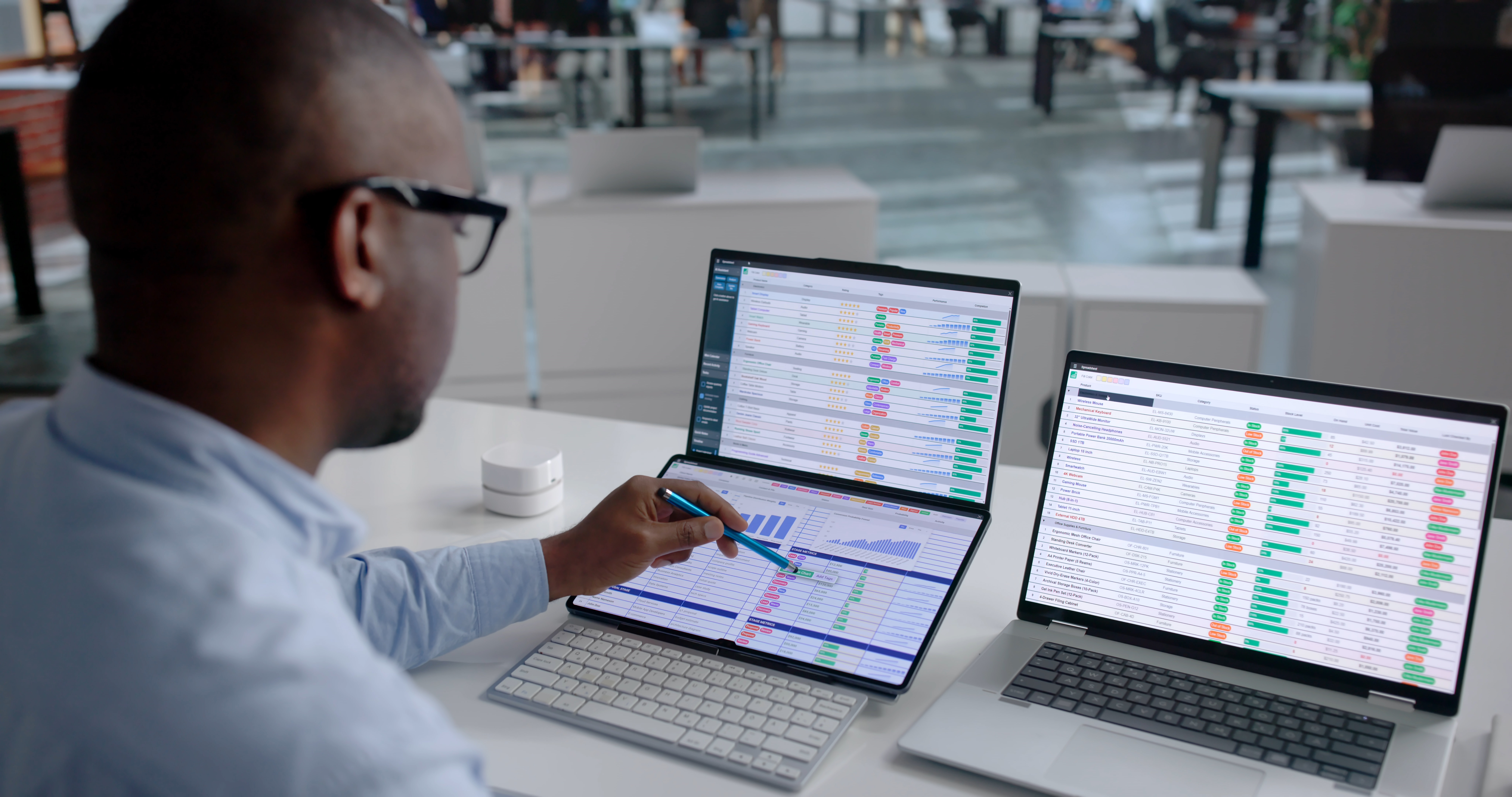 Young Man Uses Laptop To Analyze Medical Billing Codes And Claims Data.
